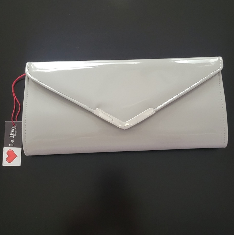 Patent leather envelope clutch with detachable shoulder strap.